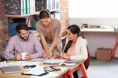 Buy stock photo Group of worker, paper and brainstorming for presentation, creative and project planning in office. Colleagues, talking and documents for teamwork, ideas and solutions for strategy and collaboration