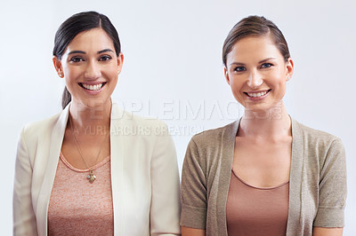 Buy stock photo Portrait, smile and business woman team in studio isolated on white background for collaboration. Face, teamwork or partnership with happy young employee and colleague together for company ambition