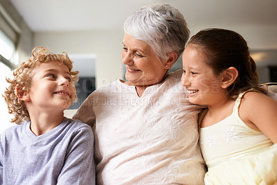 Buy stock photo Happiness, hug and home with granny, grandchildren and bonding together with weekend break and discussion. Love, family and elderly woman with kids and embrace with holiday and playful with vacation