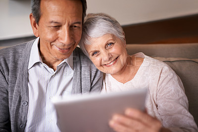 Buy stock photo Senior, couple and portrait with tablet on sofa for online bingo, crossword puzzle and internet games with smile. Elderly, man and woman with face and happiness with technology for web news in home