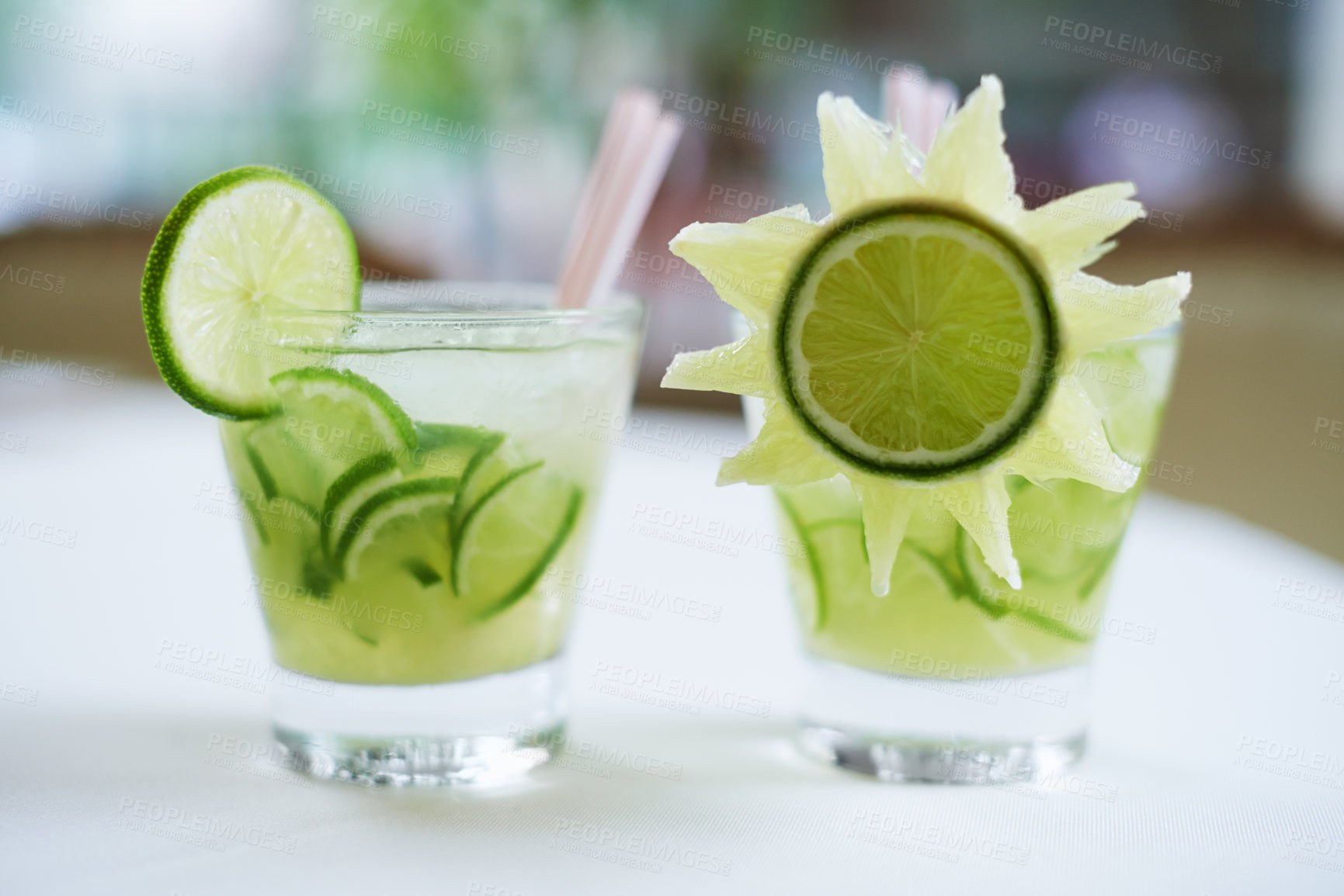 Buy stock photo Cocktail, alcohol and mojito with lime for drink on table for party, club and bar decoration. Glass, background and closeup of mocktail, beverage and liquid with fruit, ice and liquor in restaurant