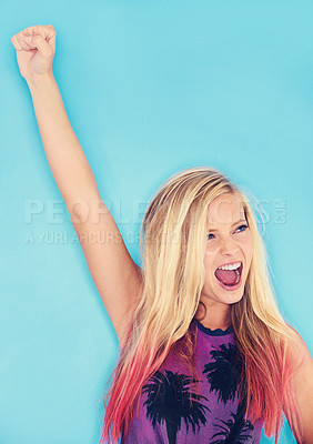 Buy stock photo Woman, celebration and fist in studio for success, lottery winner and deal on blue background. Female person, energy and promo or yes for giveaway achievement, bonus and discount or prize and sale