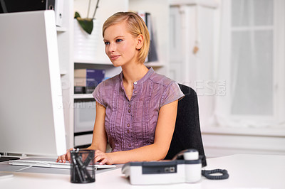 Buy stock photo Portrait of a beautiful young woman working at her desk