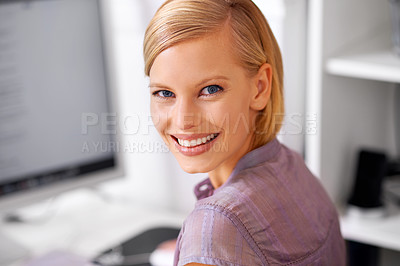 Buy stock photo Portrait of a beautiful young woman sitting at her desk in an office