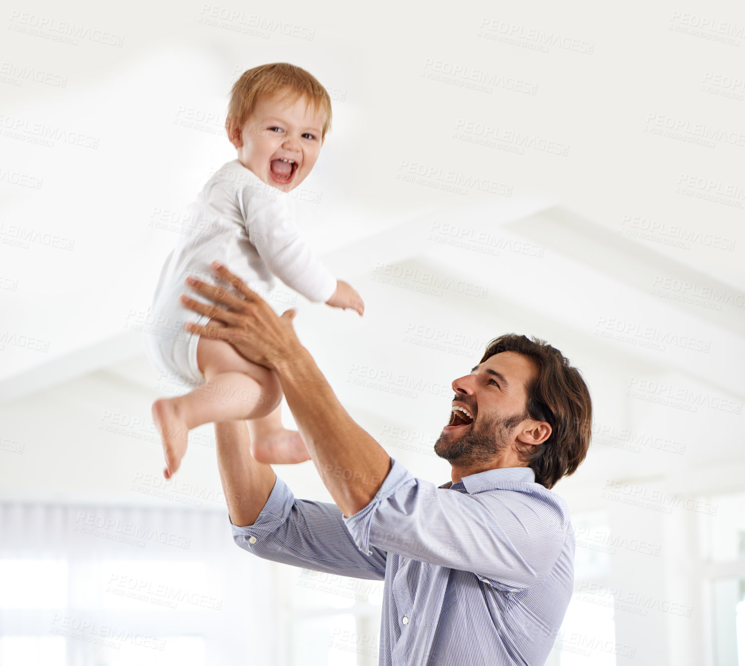 Buy stock photo Shot of a young father spending time with his baby boy