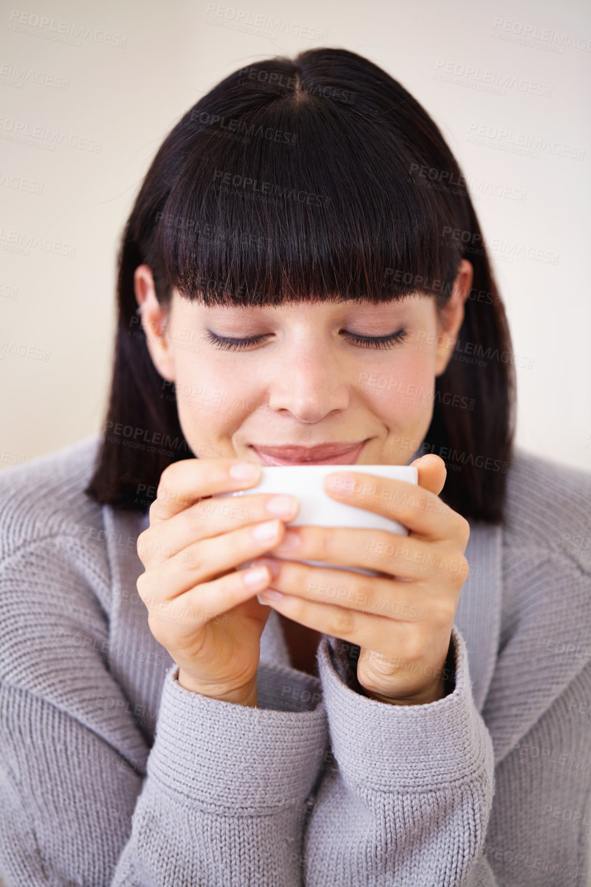 Buy stock photo Tea cup, espresso and woman in home to drink with smile from happiness of beverage. Female person, peace and morning for girl in apartment to relax, hot chocolate and cozy in house on coffee break