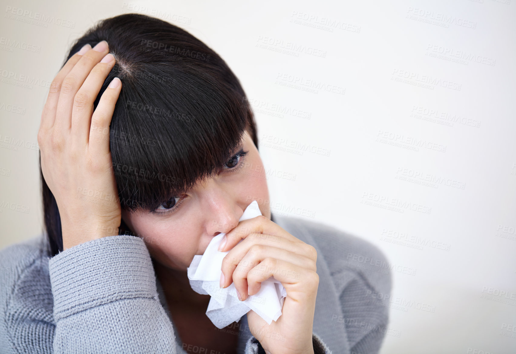 Buy stock photo woman blowing her nose