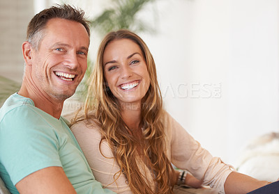 Buy stock photo Portrait of a happy couple smiling at you