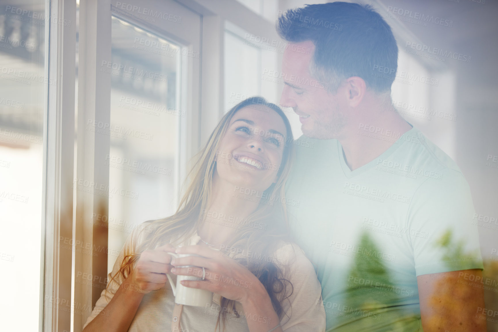 Buy stock photo Marriage, couple and coffee in home by window, relax and happy with love or commitment. Man, woman and care in modern apartment on weekend, romantic and bonding together with warm drink in morning