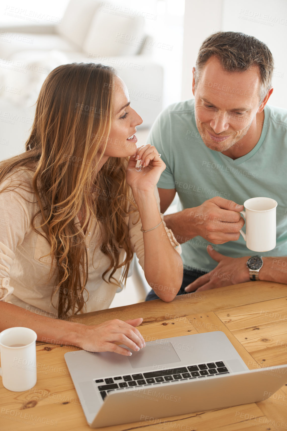 Buy stock photo Cropped shot of a couple doing their monthly budget at home