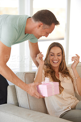 Buy stock photo Man, gift box and surprise for woman, love and trust with happy people at home. Anniversary, birthday or special event, couple with wow for present and celebration, loyalty in marriage and romance