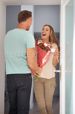 Buy stock photo Man, bouquet present and surprise for woman, love and trust with happy people at home. Anniversary, birthday and couple with present to celebrate, wow for flowers or roses with romance in marriage