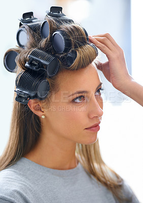 Buy stock photo A beautiful young woman spending the day getting her hair and makeup done