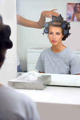 Buy stock photo Beauty, hair curlers and woman in mirror of salon with 
professional stylist for makeover.  Haircare, face reflection or curling and celebrity or actress getting ready backstage behind the scenes