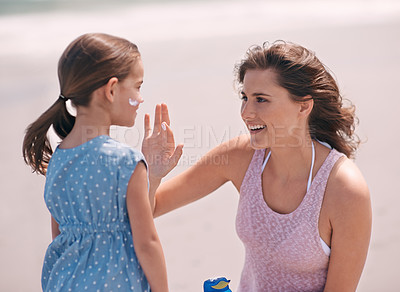 Buy stock photo Woman, child and sunscreen protection on beach or summer holiday on tropical island, application or bonding. Female person, daughter and lotion at California seaside or care, healthy skin or safety