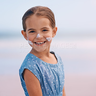 Buy stock photo Young child, portrait and outdoors with sunscreen, smile and cheerful on holiday vacation. Little girl, happy and cute confidence for getaway, fun and skincare for protection and summertime