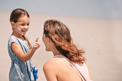 Buy stock photo Mother, daughter and nose with sunscreen on beach for summer protection for healthy skin, safety or weekend. Woman, child and happy in Florida for bonding holiday for vacation, sunshine or outdoor