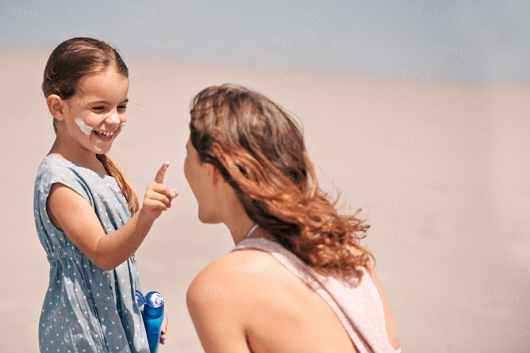 Buy stock photo Mother, daughter and nose with sunscreen on beach for summer protection for healthy skin, safety or weekend. Woman, child and happy in Florida for bonding holiday for vacation, sunshine or outdoor