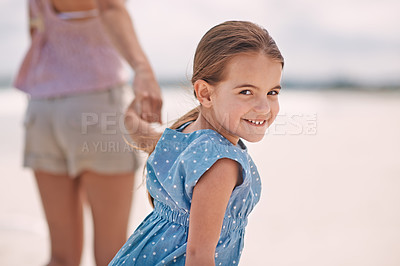Buy stock photo Happy girl, portrait and holding hands with mother at beach for walk, bonding or holiday weekend in nature. Female person, child or kid with smile, parent or mom in outdoor fun or summer by the ocean