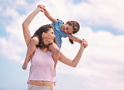Buy stock photo A little girl and her mother at the beach