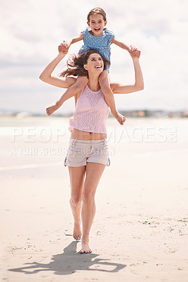 Buy stock photo Happy mom, beach and child on piggyback for fun summer, playful holiday or outdoor weekend in nature. Mother and daughter or kid on shoulders with smile for bonding, love or support by ocean coast