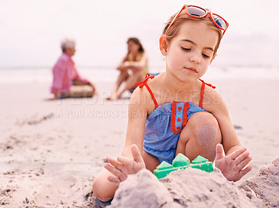 Buy stock photo Child, beach and sandcastle building on holiday for summer travel with family for environment, playing or swimwear. Girl, seashore and outdoor in Australia with parents or recreation, fun or vacation