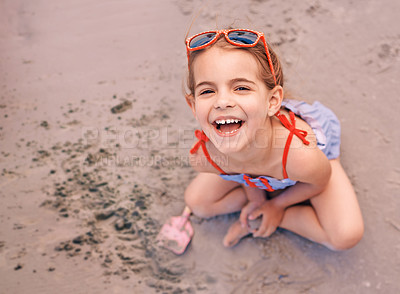 Buy stock photo Happy, portrait and little girl playing with sand at the beach for fun holiday, weekend or summer. Face of female person, child or kid with smile in happiness for day by the sandy shore in nature