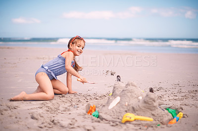 Buy stock photo Happy girl, toys and playing with beach sand, castle or summer fun on outdoor holiday or weekend in nature. Female person, child or kid with smile for water or building sandcastle by ocean coast