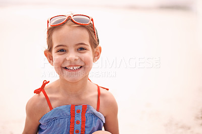 Buy stock photo Happy, portrait and little girl with fashion at the beach for fun holiday, weekend or summer on mockup space. Face of person, child or kid with smile in happiness for day by the sandy shore in nature