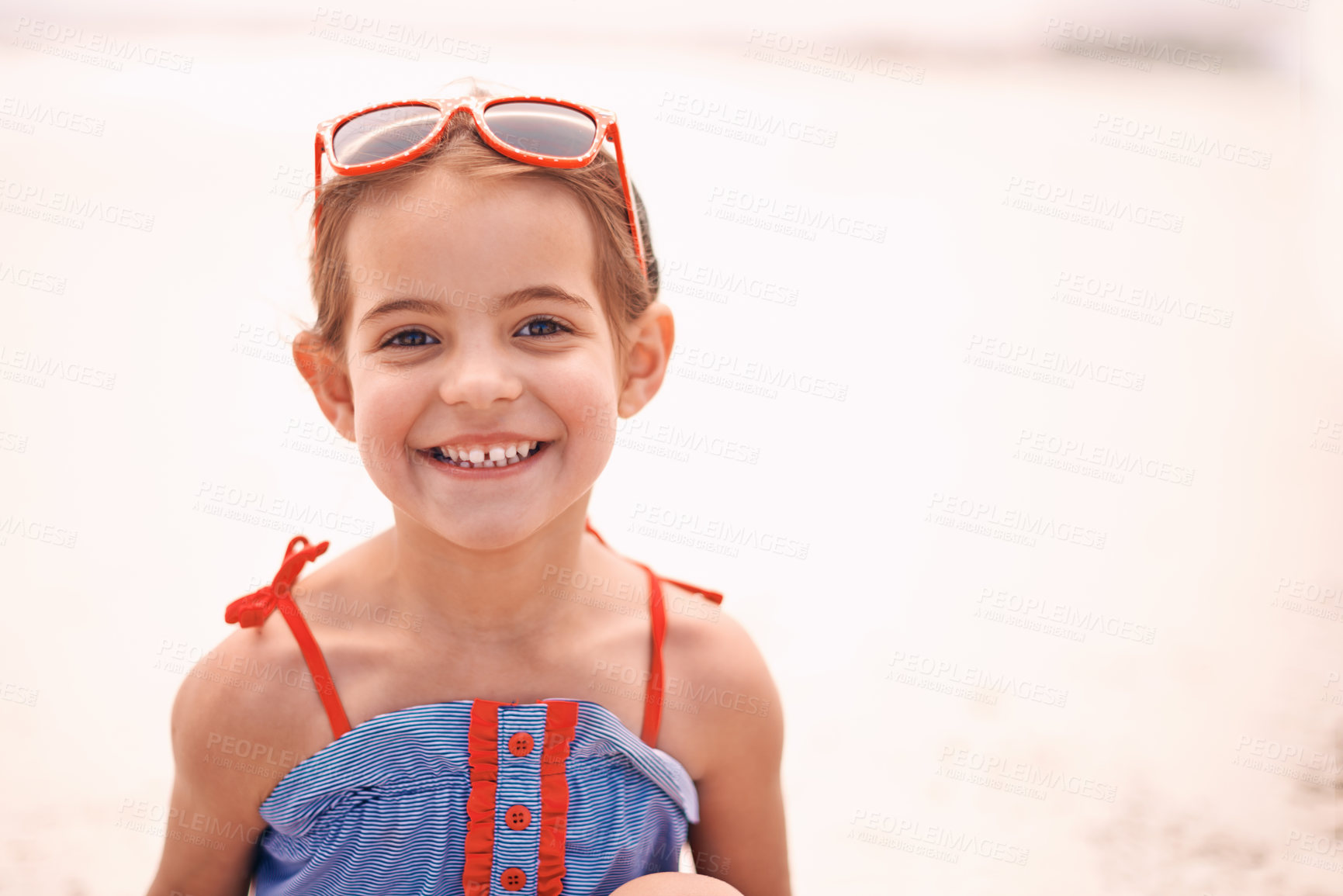 Buy stock photo Happy, portrait and little girl with fashion at the beach for fun holiday, weekend or summer on mockup space. Face of person, child or kid with smile in happiness for day by the sandy shore in nature