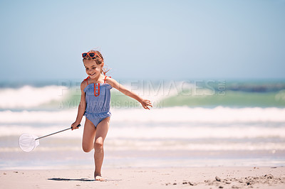 Buy stock photo Happy, little girl and playing with net at the beach for fun holiday, weekend or outdoor summer on mockup. Excited person, child or young kid with smile for day of catch by the ocean coast in nature