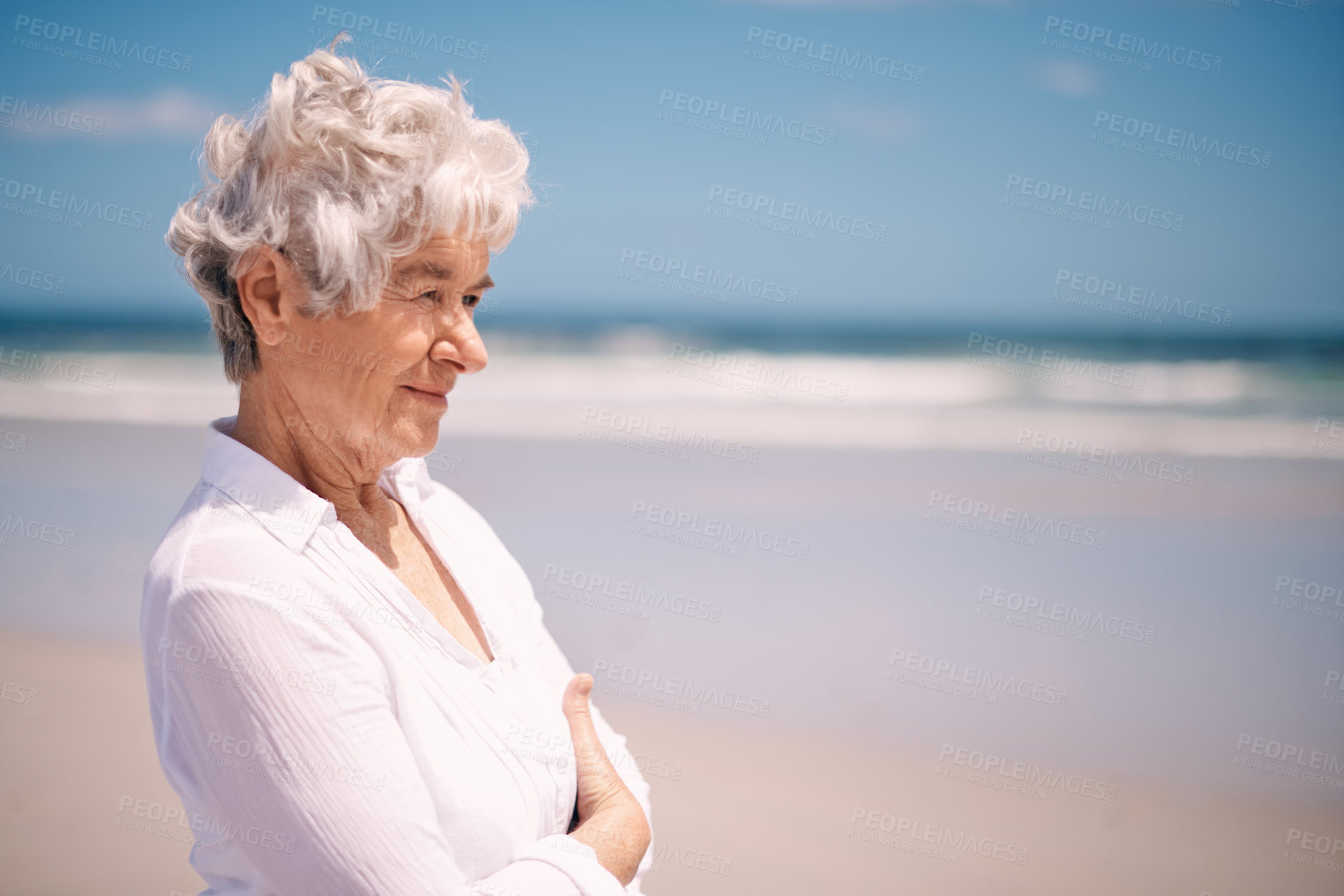 Buy stock photo Elderly woman, smile and relax on beach for summer, happiness and peace in outdoors. Mature female person, retirement and enjoying on vacation journey, ocean and water for weekend or holiday