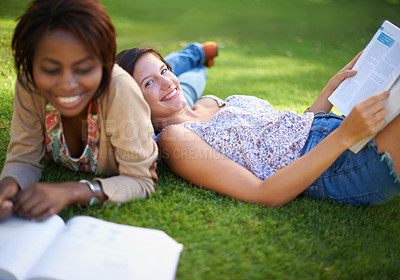 Buy stock photo Cropped shot of a two beautiful young college students studying outside