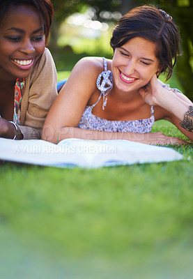 Buy stock photo Reading, students and women with books on grass for knowledge, learning and studying at college. University, education and friends with textbook for literature, research and information in park