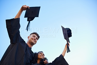 Buy stock photo Graduation, university and students with blue sky for learning, studying and knowledge on academy campus. Education, friends and man and woman with hat for celebration, graduate ceremony and college