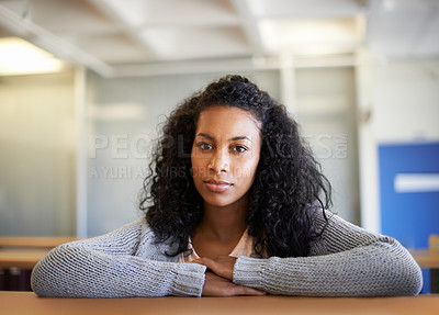 Buy stock photo Shot of a young woman in the university library