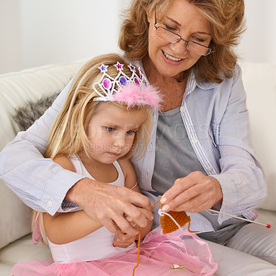 Buy stock photo Grandmother, child and teaching knitting with needle or creative pattern design or bonding connection, hobby or handmade. Woman, girl and princess costume at home or learning sewing, craft or sweater