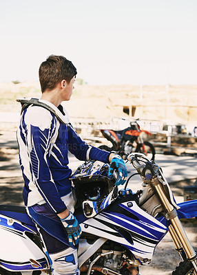 Buy stock photo Motorcycle, extreme sport and man for race on trail for competition, vision or games with speed. Racer, motorbike and thinking for contest, motor cross and fast transportation with sunshine in desert