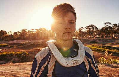 Buy stock photo Man, motocross rider or portrait for extreme sport in nature, confident or skill in driving with speed. Man, pride face or gear for motorcycle or off road action or danger with fast vehicle in wood