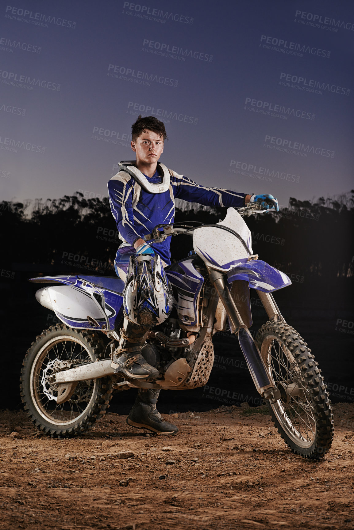 Buy stock photo Extreme sport, portrait and man with off road motorbike, confidence and gear for competition, race or challenge. Adventure, adrenaline and serious face of athlete on course with dirt bike at night