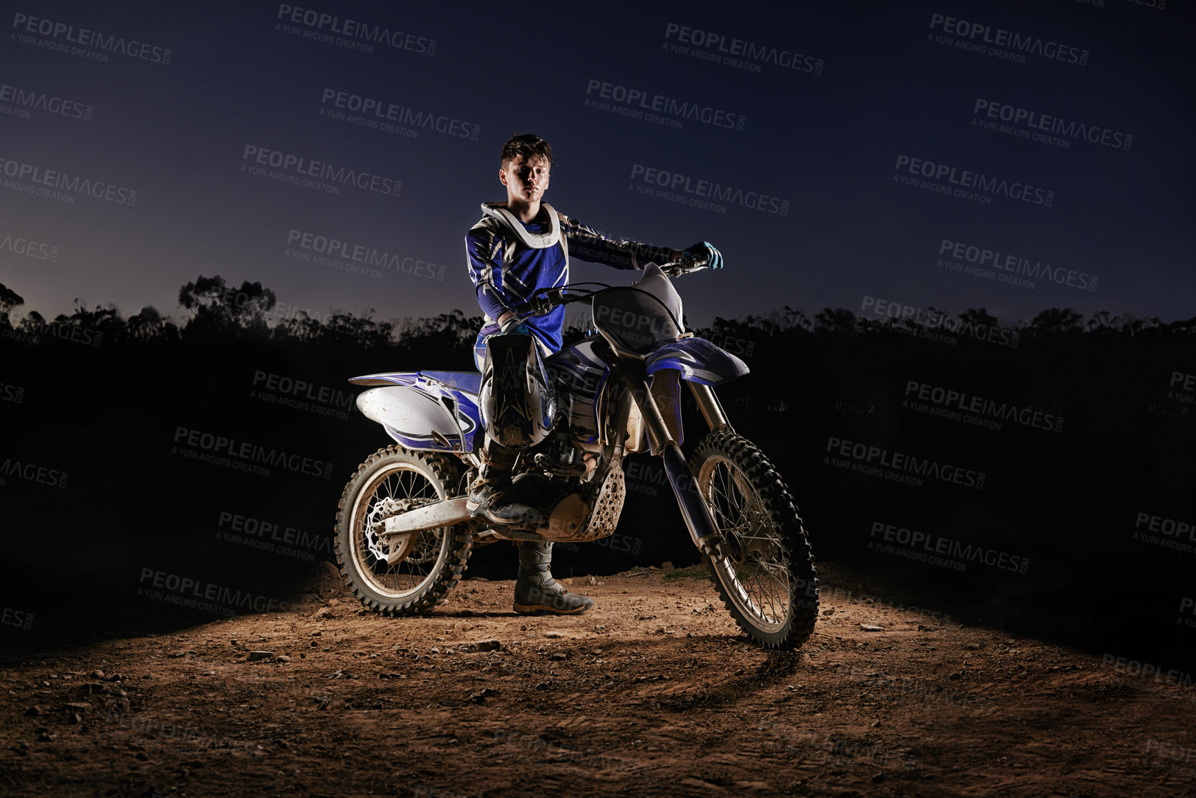 Buy stock photo Extreme sport, portrait and man with dirt bike, confidence and gear for competition, race or challenge. Adventure, adrenaline and serious face of athlete on course with off road motorbike at night