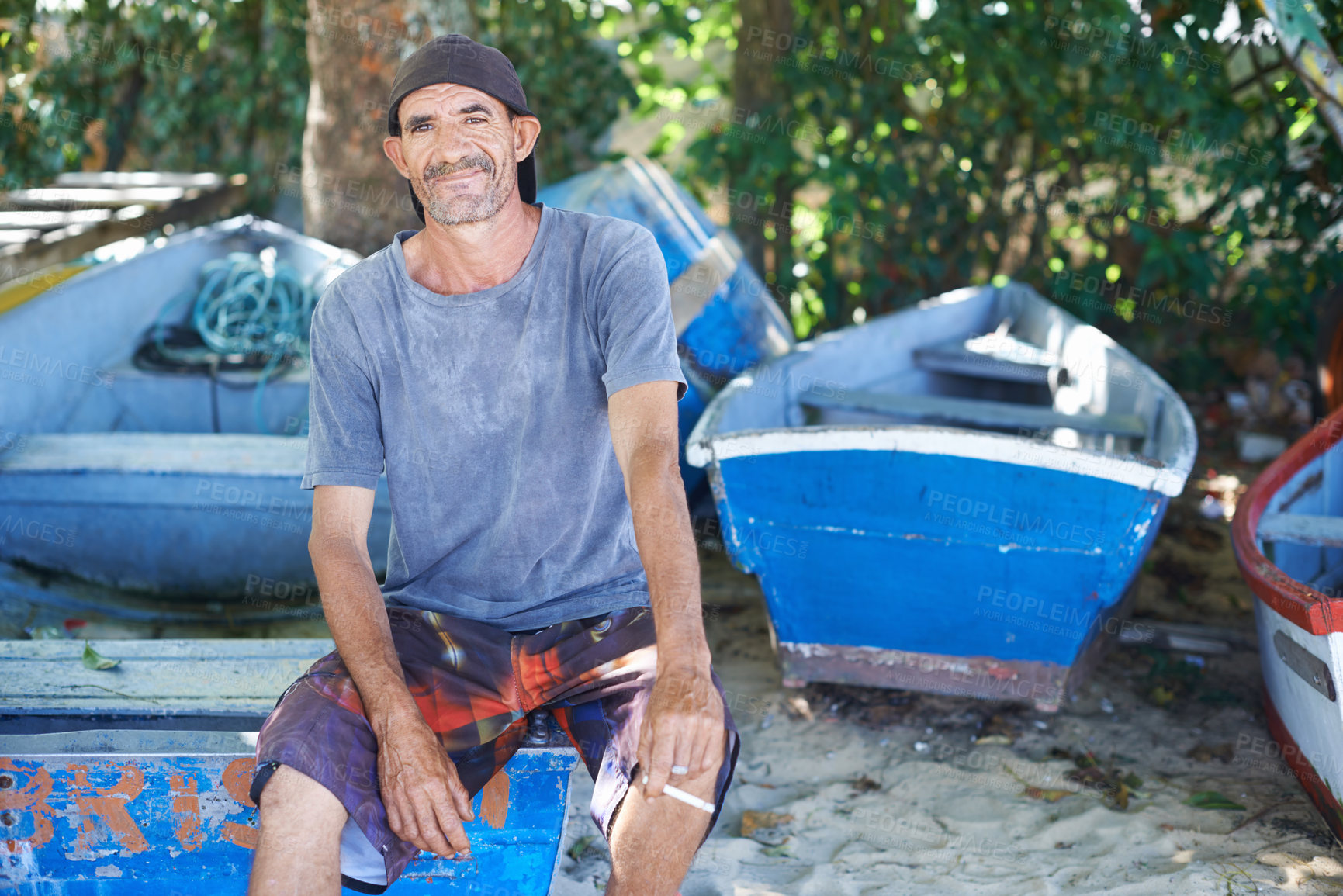 Buy stock photo Portrait, man and fisherman on boat by beach outdoor in summer or smoking cigarette in nature. Fishing, mature person and worker by ship at seaside or sailor on transportation for travel in Australia