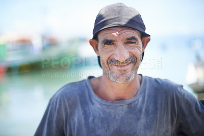 Buy stock photo Fisherman, portrait and rugged man with smile, harbour and wrinkles from sunlight exposure. Boats, ships and water or fishing for work in Brazil, closeup and senior male angler for career by ocean