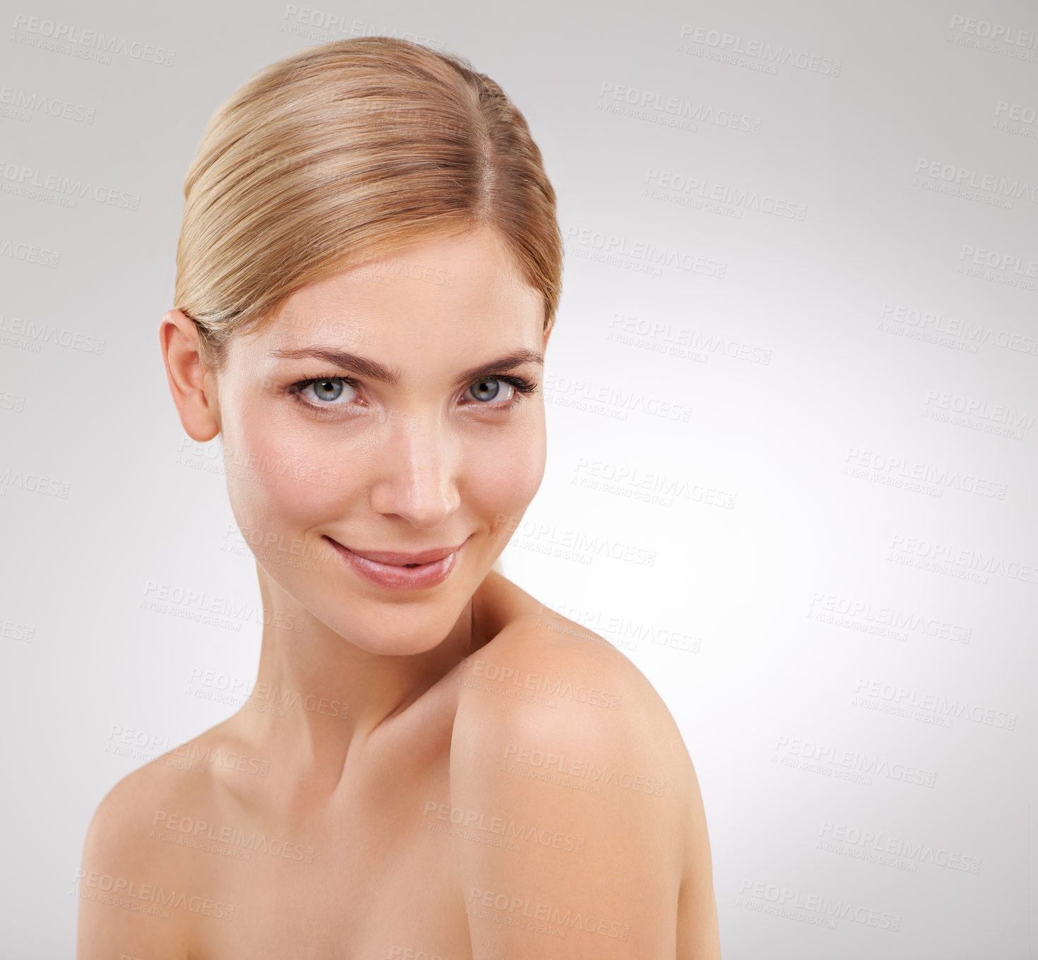 Buy stock photo Cropped portrait of a beautiful young woman in the studio