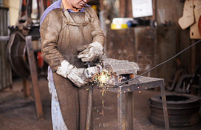 Buy stock photo Blacksmith, person and grinder for metal with sparks, design or industry for metallurgy in factory. Man, worker or small business owner with power tools, steel or iron with manufacturing in warehouse