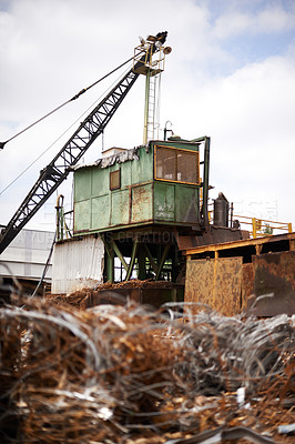 Buy stock photo Crane, machine and scrapyard for moving metal with sustainability, manufacturing or stop pollution. Vehicle, tractor and outdoor in junkyard, plant or ecology for iron, steel industry and environment