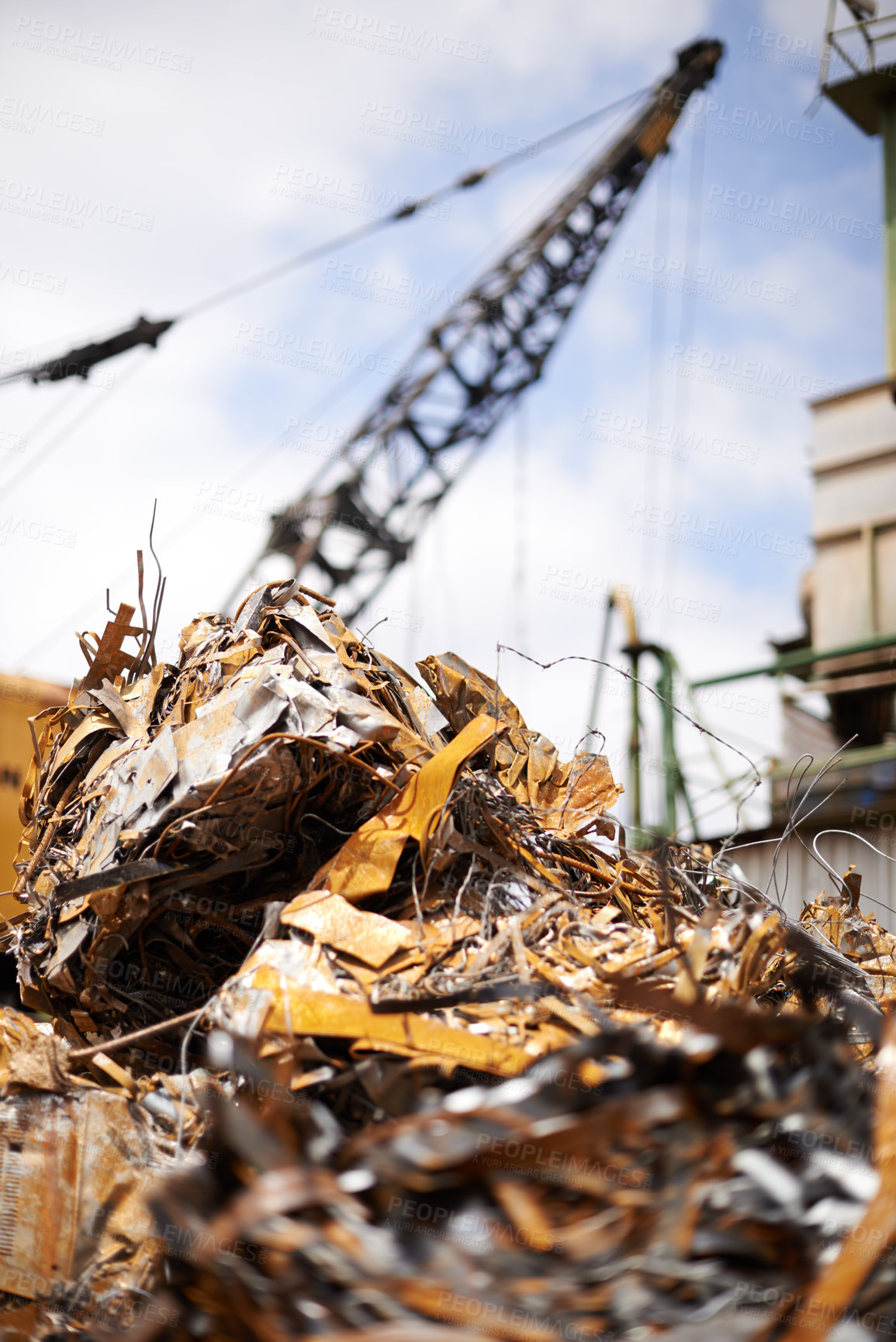 Buy stock photo Cropped shot of a crane at work in a dumpsite