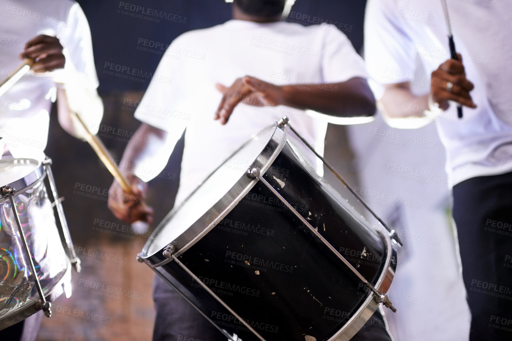 Buy stock photo Hands, drum or festival with a band playing an instrument in a carnival in Rio de Janeiro, Brazil. Night show, person or party with a musician, performer or artist banging to create a beat or rhythm