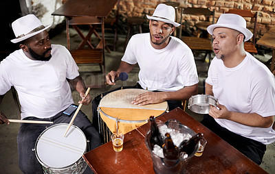 Buy stock photo Musician, band and friends with beer, men and happy for drums, performance and party with alcohol. Group, artist and singing with bottle, drink and relax in pub for social event in Rio de Janeiro