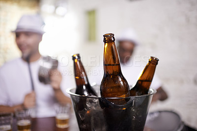 Buy stock photo Beer, bottle and musician in performance at club on drums for carnival, festival or party. Night, club and event with alcohol closeup with people with creative energy, samba or salsa beat with rhythm